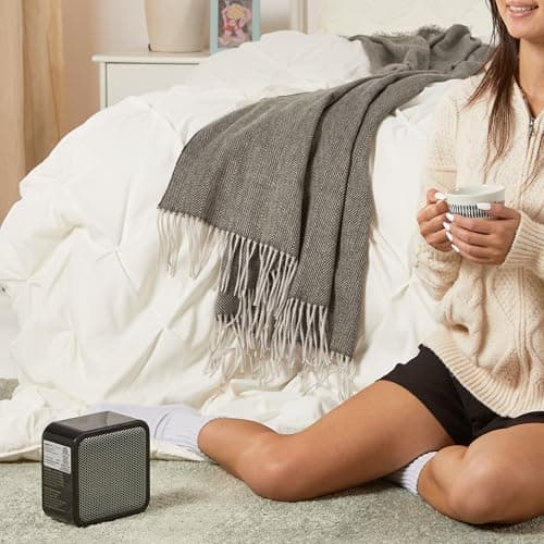 Amazon Basics Ceramic Space Heater, Mini Heater for Office Desk, Portable Tent Heater for Camping (Indoor Use), 500 W, With Tip-Over Protection, Lightweight (1.4 LBS), Black, 5.8"D x 3.4"W x 6"H