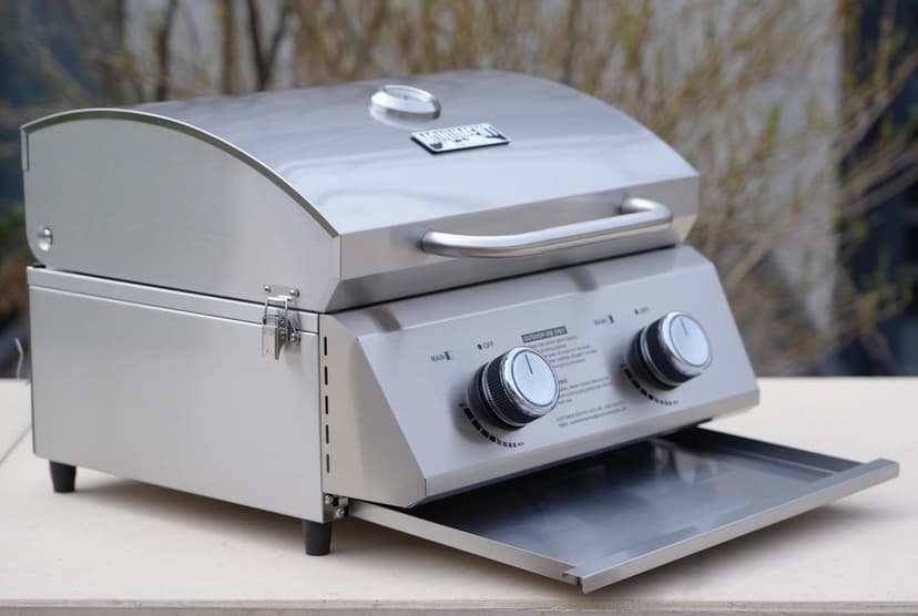 Monument Grills Tabletop Propane Gas Grill for Outdoor Portable Camping Cooking with Travel Locks, Stainless Steel High Lid, and Built in Thermometer