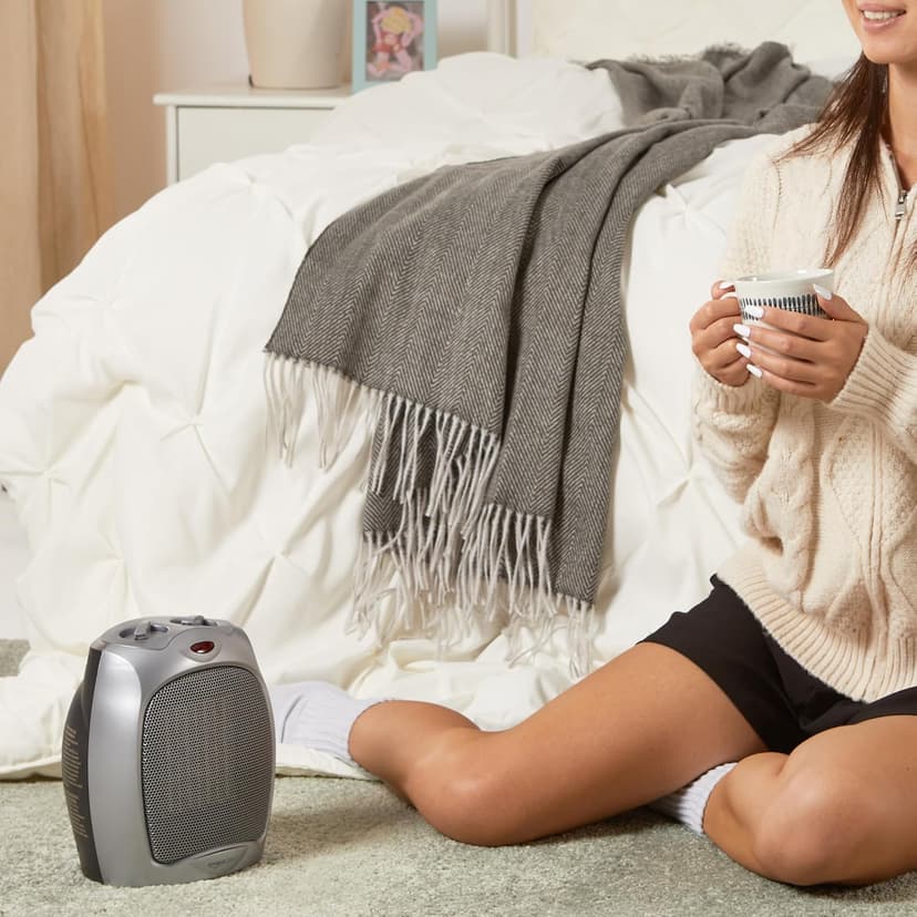 Amazon Basics Ceramic Space Heater, Portable Heater for Indoor Use, for Office and Home, With Overheat and Tip-Over Protection, Thermostat, Non-Oscillating, 1500W, Silver, 7.52"D x 6.34"W x 9.45"H