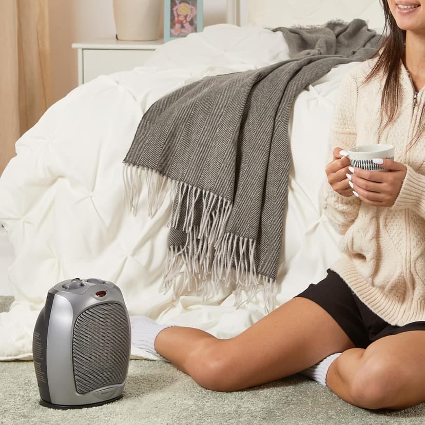 Amazon Basics Oscillating Ceramic Space Heater, Portable Heater for Indoor Use, for Office and Home, With Overheat and Tip-Over Protection, Thermostat, 1500W, Silver, 7.52"D x 6.34"W x 9.45"H